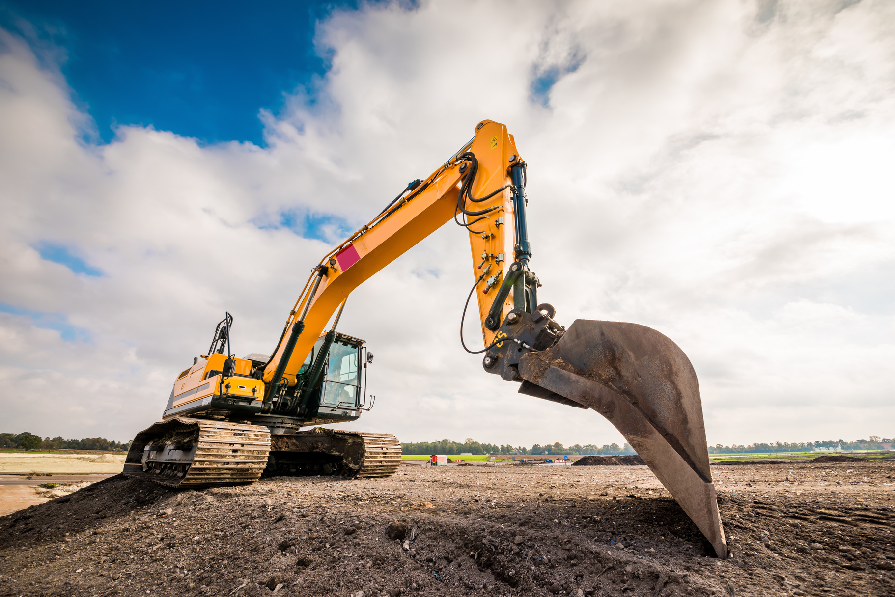 Big excavator in construction site